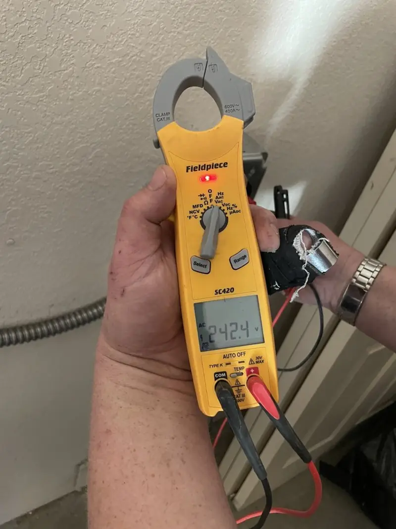 Voltage testing with clamp meter during Outlet Installation in Martins Ferry